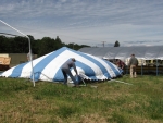 Raising the striped tent 1