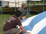 Raising the striped tent 2