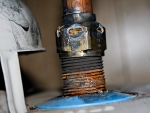 03 Holes burned in water heater fitting. Photo Jake Jakabosky